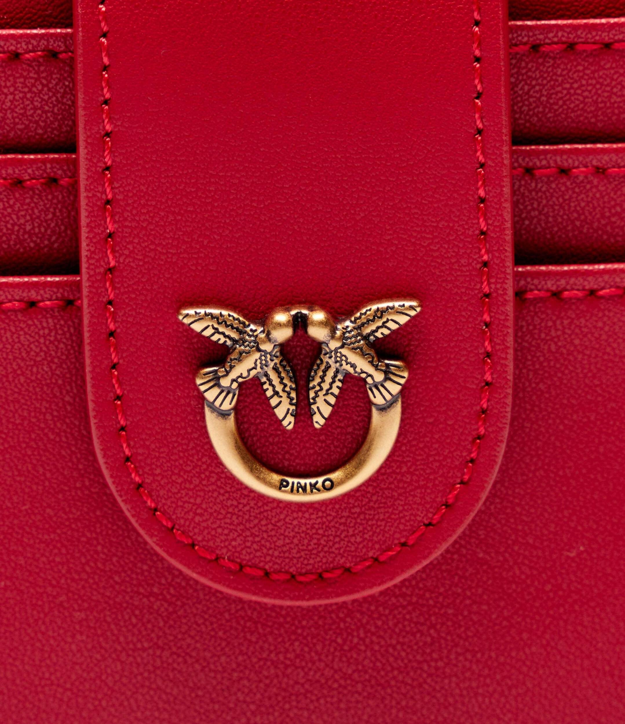 small smooth leather wallet with logo in red